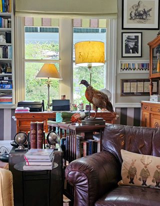 Leather armchair amnd pheasant in vintage interior on Greytown House & Garden tour